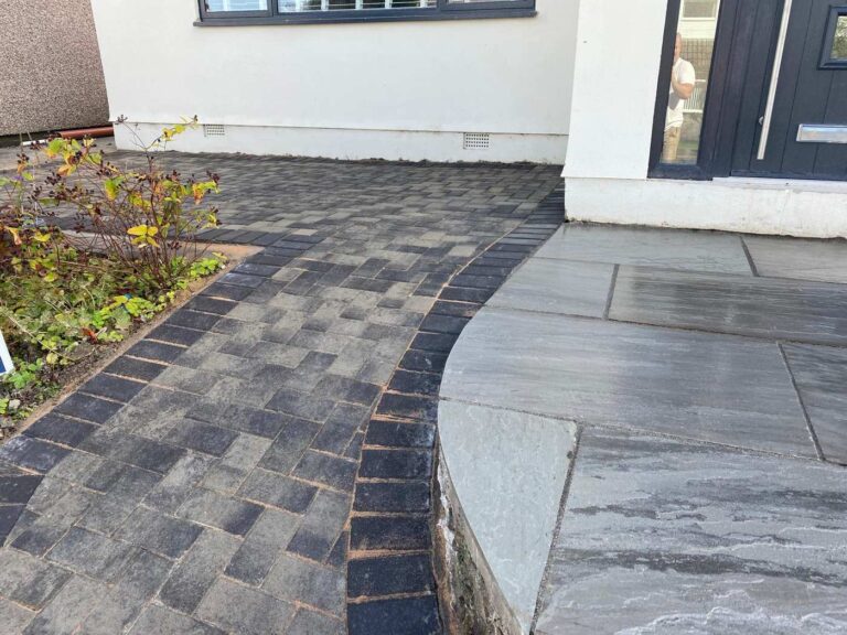 Block paving meeting a raised porcelain area