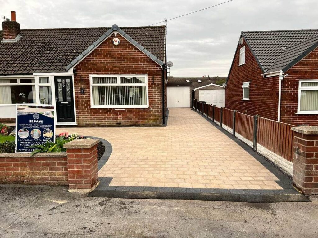 Buff block paved driveway with a charcoal border at a bungalow