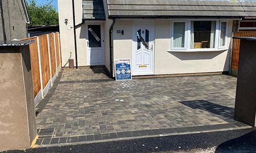 Charcoal block paved driveway at a semi-detached house