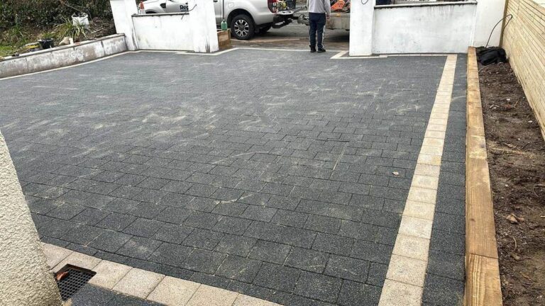 Charcoal block paving with a timber edge