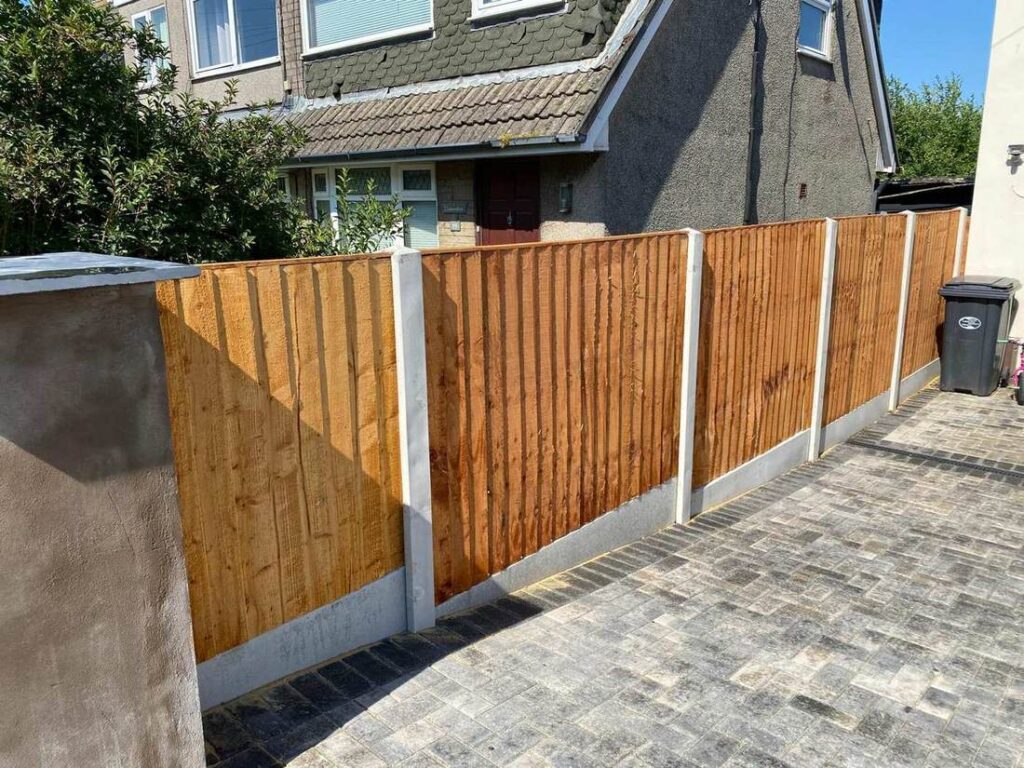 Closeboard timber fence above new block paving