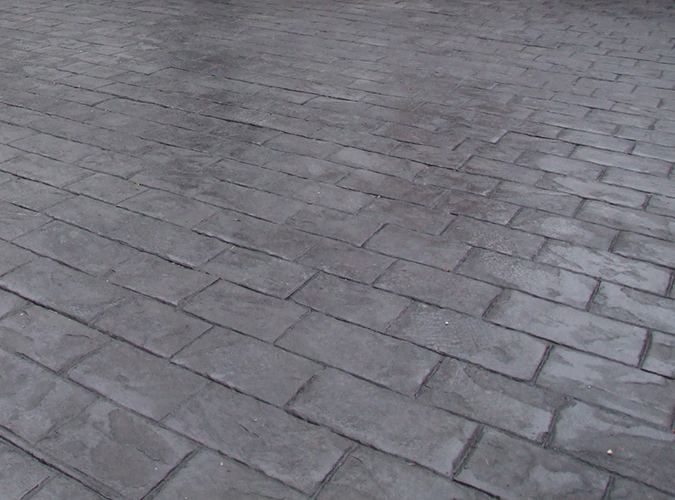 Close-up of dark pattern imprinted concrete