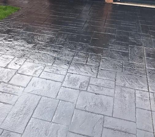 Close-up of dark slate pattern imprinted concrete