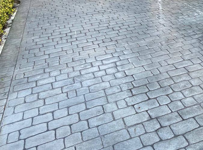 Grey pattern imprinted concrete in a cobble design