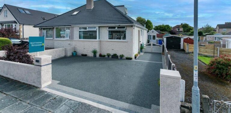 Grey resin bound driveway at a bungalow