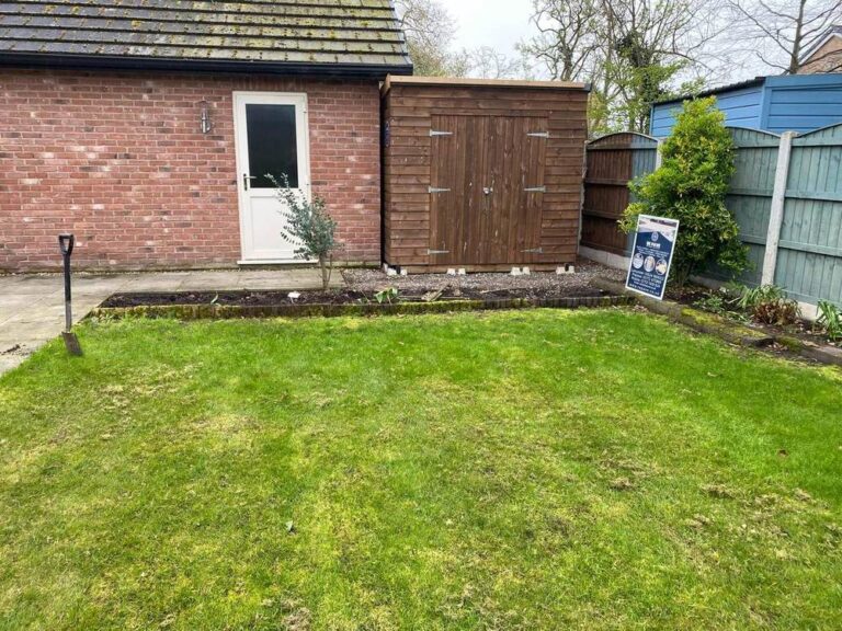 New lawn in front of a garden shed