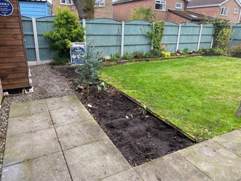 Paved path beside a new lawn