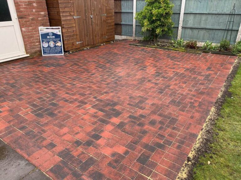 Red block paved patio in a back garden