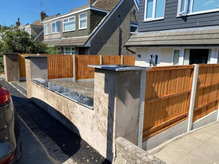 Rendered front garden wall with timber fencing