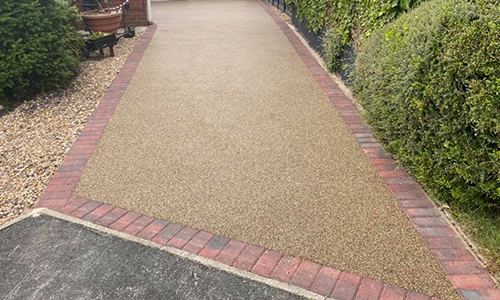 Gold resin bound path with a red brick border
