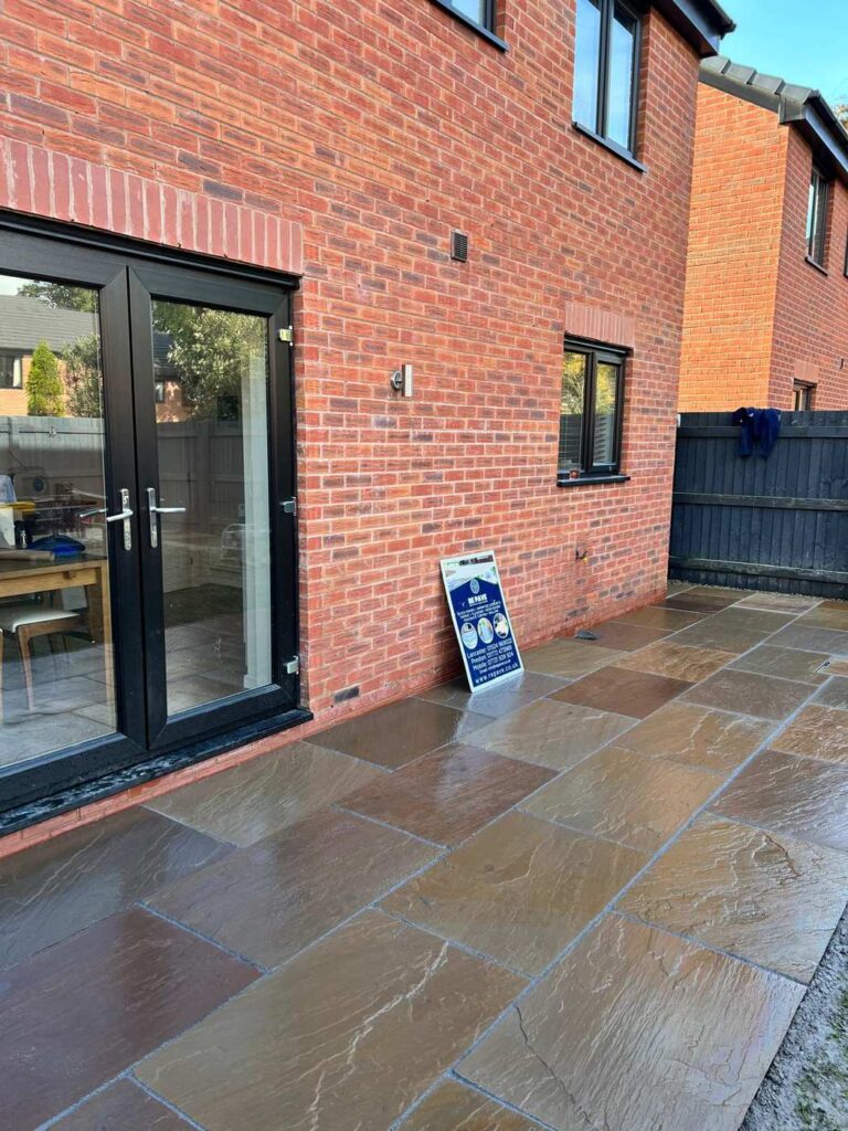 Indian sandstone patio outside French doors