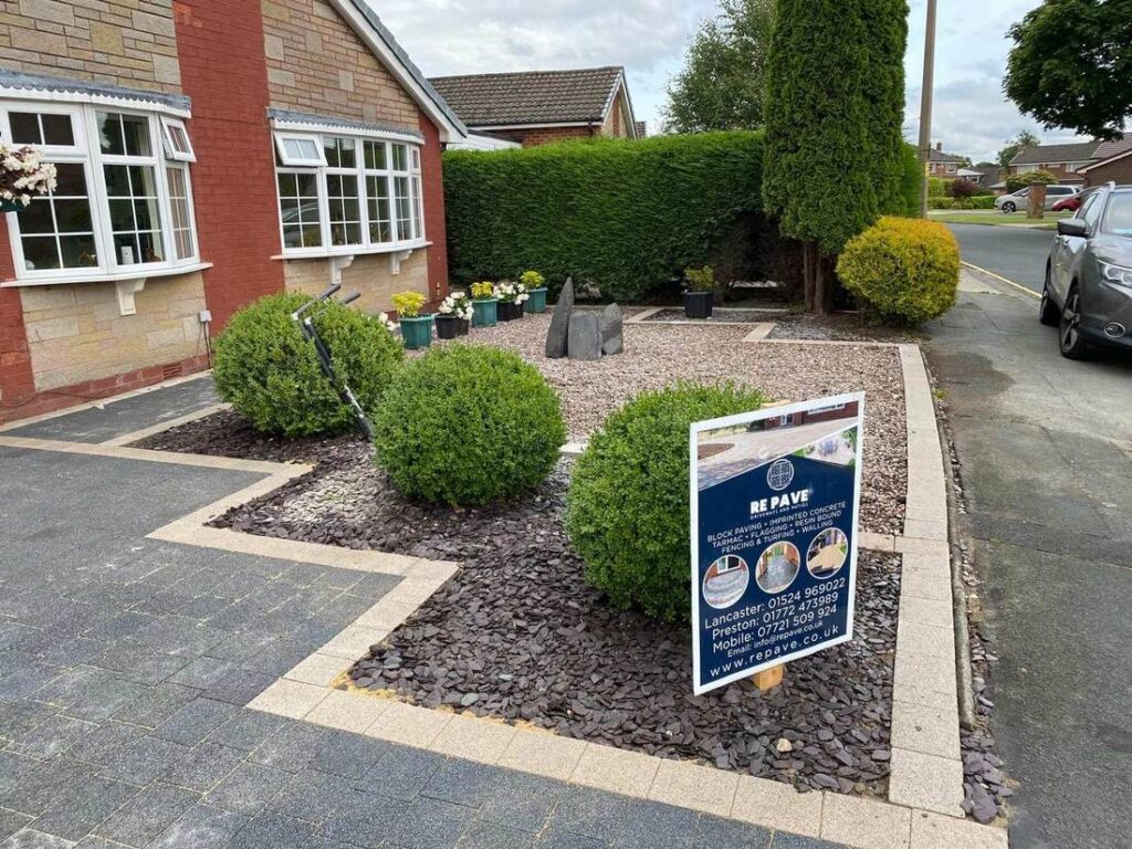 Slate chipping borders with block edging and shrubs