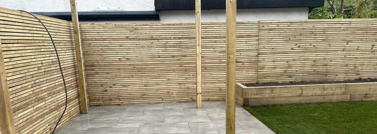 Slatted timber privacy fence