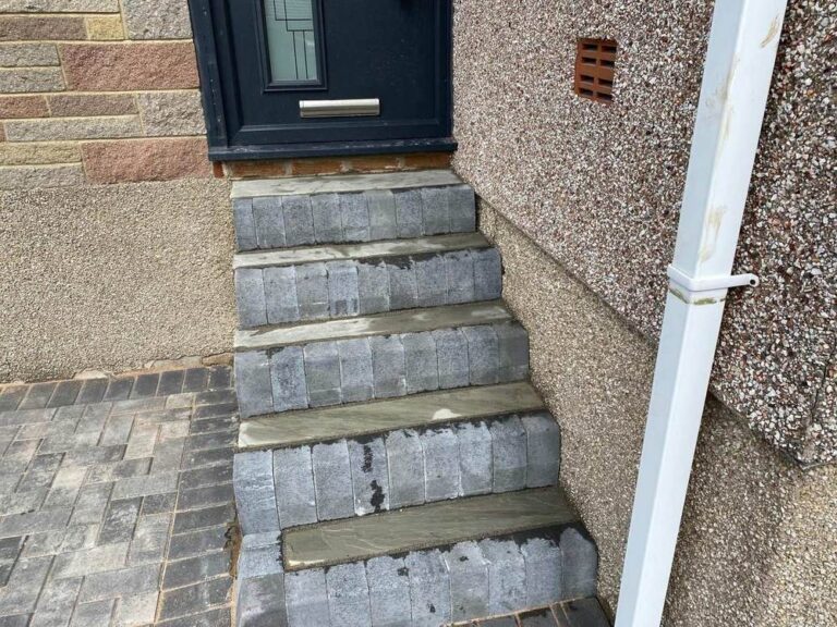 Stone steps above block paving