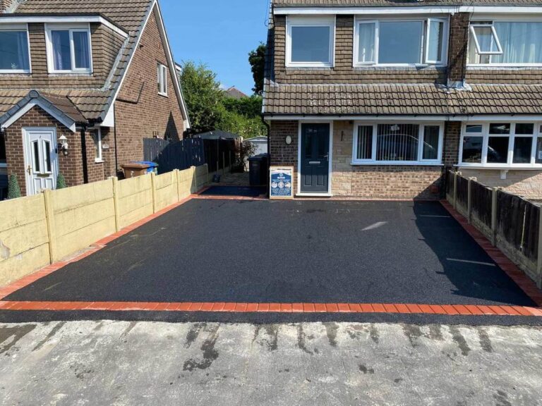 Tarmac driveway with a red border at a semi-detached house