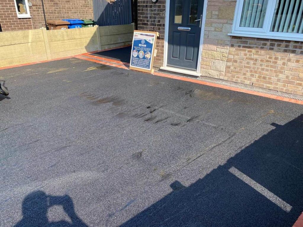 Tarmac driveway with red block edging